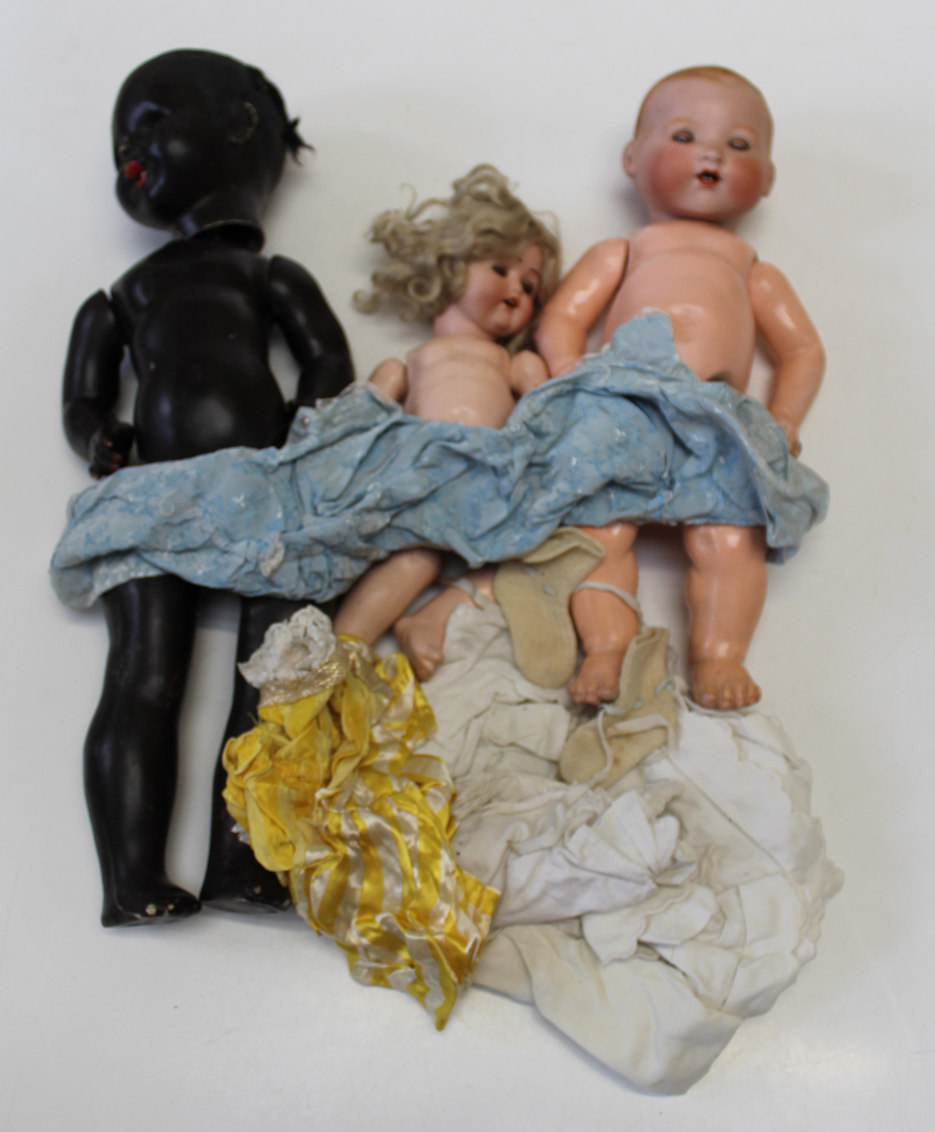 Three dolls, to include two bisque headed examples, one an Armand Marseille example, the other a