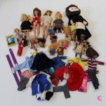 Three circa 1960's Sindy dolls and a Paul figure, together with a good quantity of costume, six