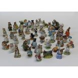 A large collection of Beatrix Potter porcelain figures, predominately Beswick but also including