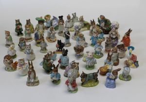 A large collection of Beatrix Potter porcelain figures, predominately Beswick but also including
