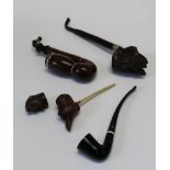 An early 20th century German briar pipe with storm cap, 20cm together with two others, each with