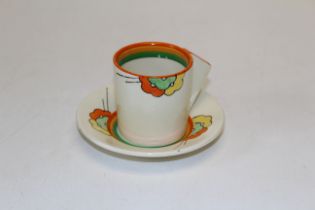 A 1930's Clarice Cliff Bizarre Nemesia coffee can and saucer, number 8876. Painted and printed