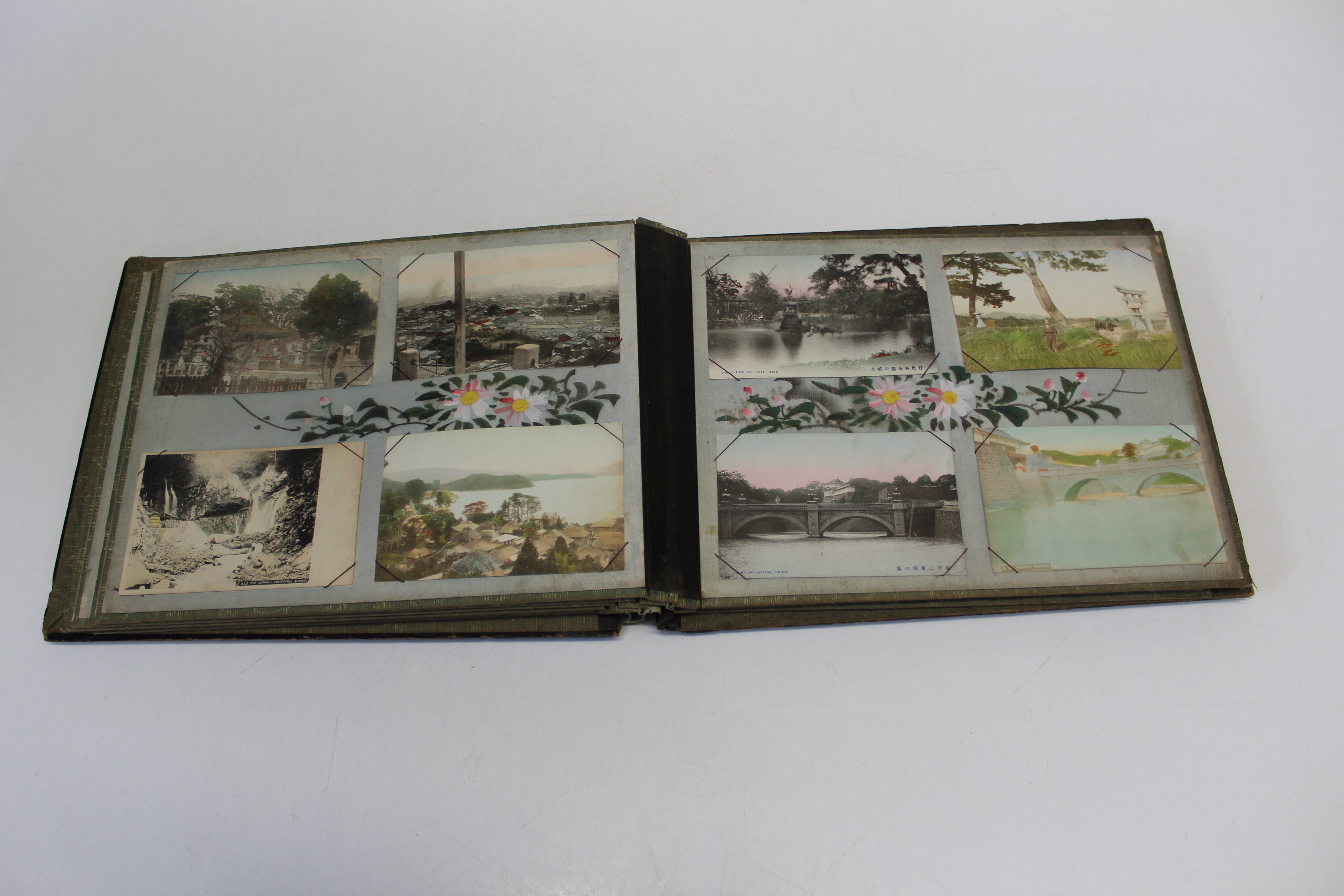 An early 20th century Japanese black lacquer postcard album, containing approximately seventy early/ - Image 3 of 3