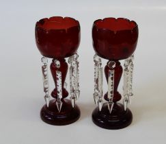 A pair of 19th century ruby glass table lustres, of stemmed form with faceted drops (2)