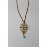 An Edwardian lavaliere pendant set with turquoise and seed pearls, marked 9ct to the bale,