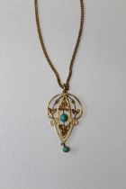 An Edwardian lavaliere pendant set with turquoise and seed pearls, marked 9ct to the bale,