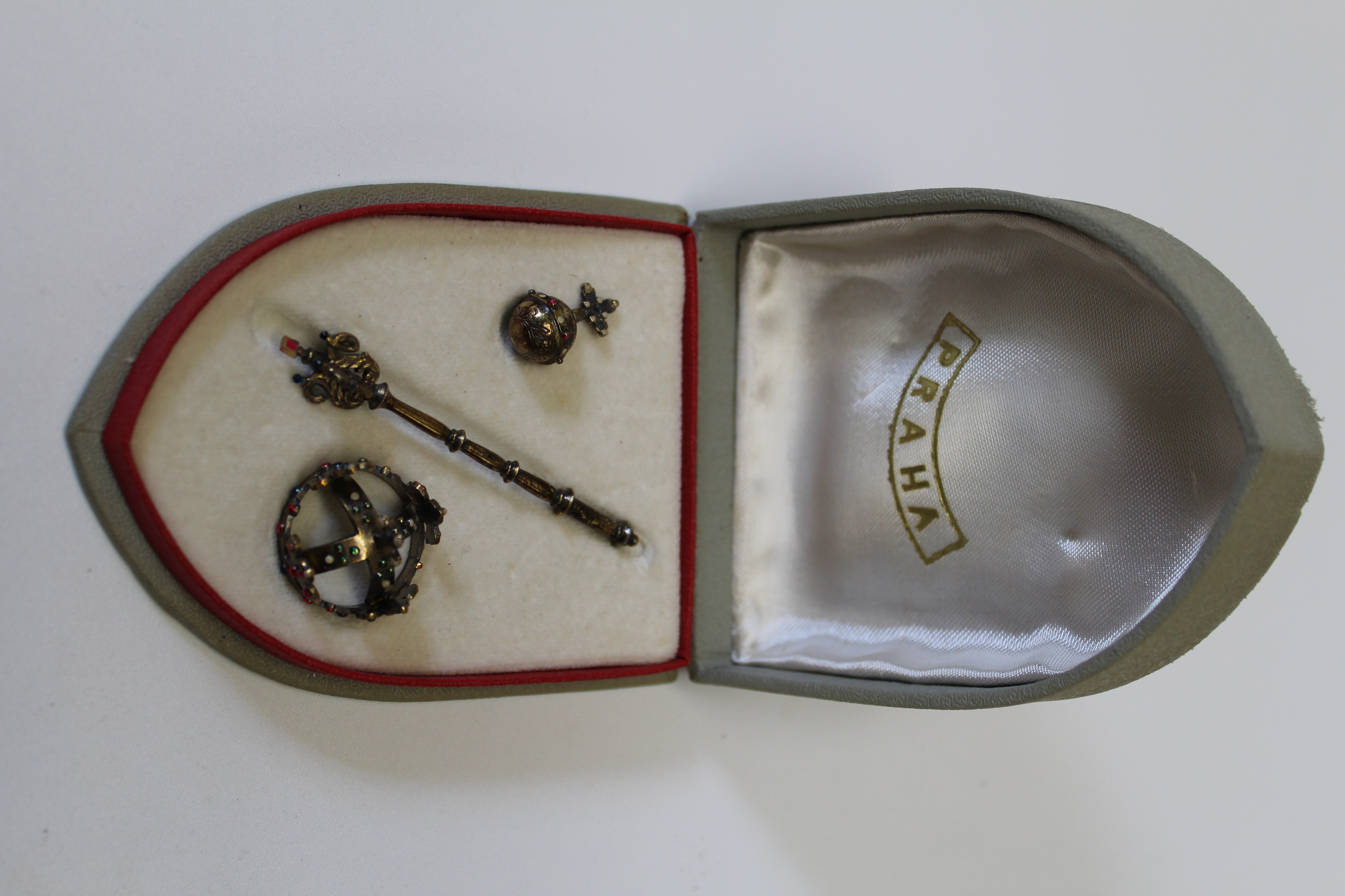 An early/ mid 20th century Czechoslovakian silver gilt miniature crown, orb and sceptre, cased