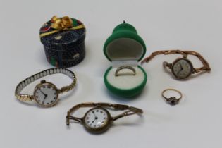 A collection of 9ct gold jewellery to include two dress rings and two gold cased wristwatches, one