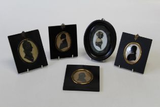19th century English School, a silhouette portrait miniature of a lady with tied hair and fur