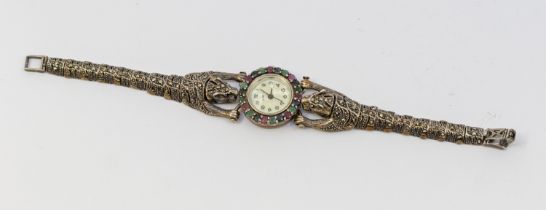 A ladies silver 925 gem set wristwatch, comprising a pearlized dial with arabic markers, the bezel