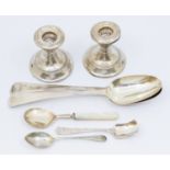 A collection of silver items to include; a pair of George III silver table spoons, each with