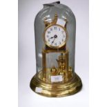 An early 20th Century brass anniversary clock with glass dome.