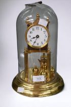 An early 20th Century brass anniversary clock with glass dome.