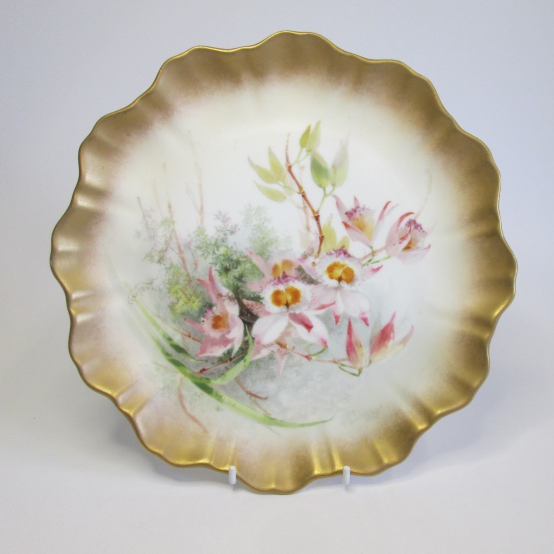 A Royal Doulton, Burslem Rd No 72067 scalloped plate hand painted and signed D Dewsberry, marked