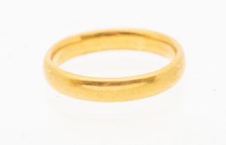 A 22ct gold wedding band, width approx 3mm, size P, weight approx 5.6gms .