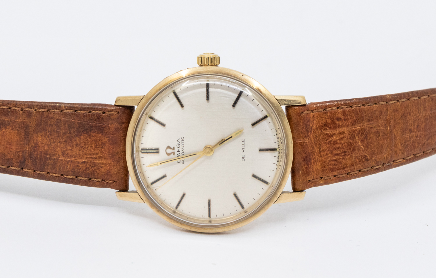 Omega-a gentleman's 9ct gold Omega De Ville vintage wristwatch, comprising a signed silvered dial,