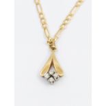 A diamond and 9ct gold pendant, comprising four small diamonds to a gold V detail, length approx