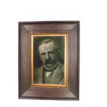 A George Cartlidge ceramic tile of a gentleman, possibly David Lloyd George, within wooden frame (