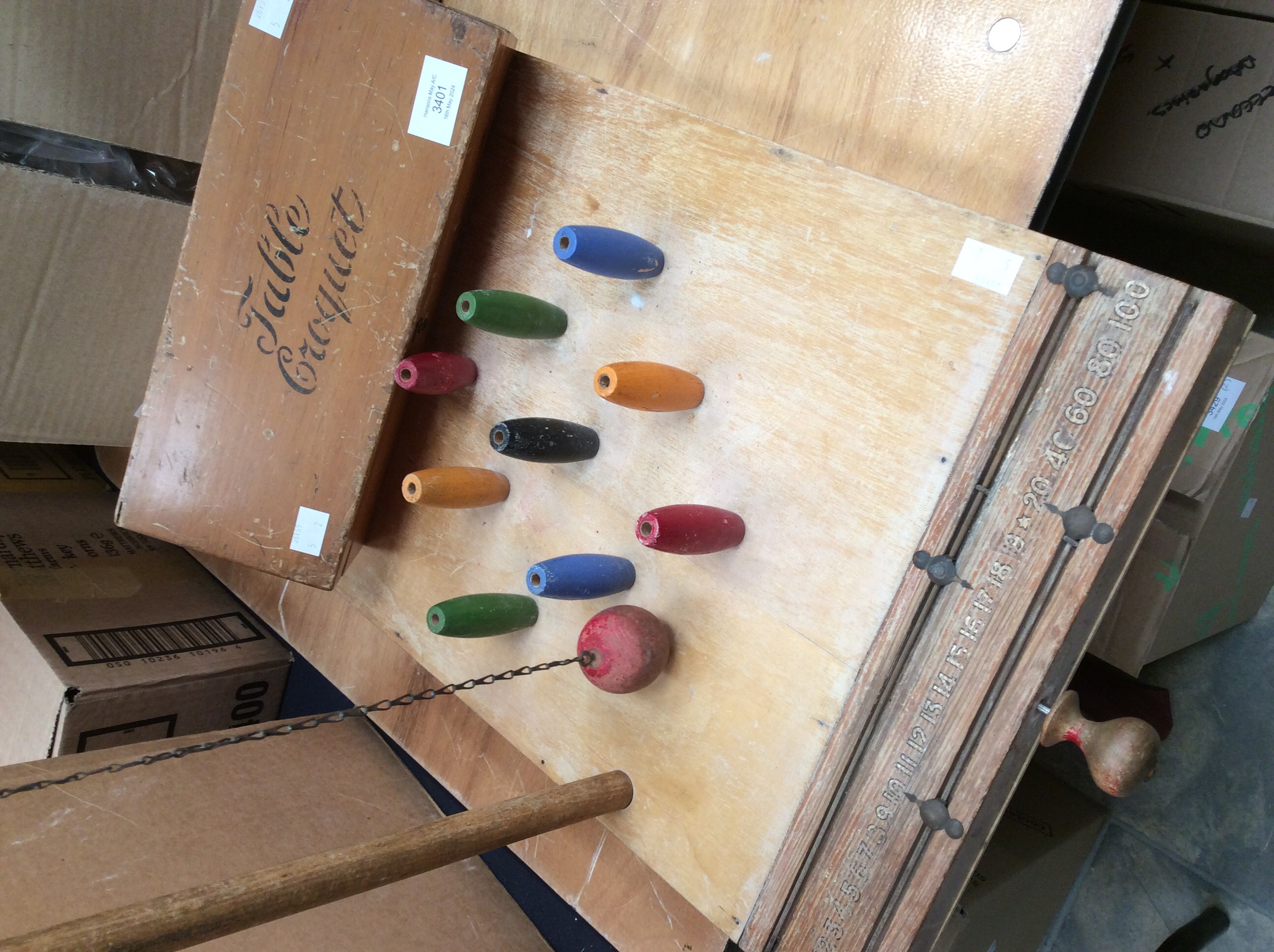 A table croquet set by F.H. Ayres Ltd, in box, along with a table skittles set, multicoloured