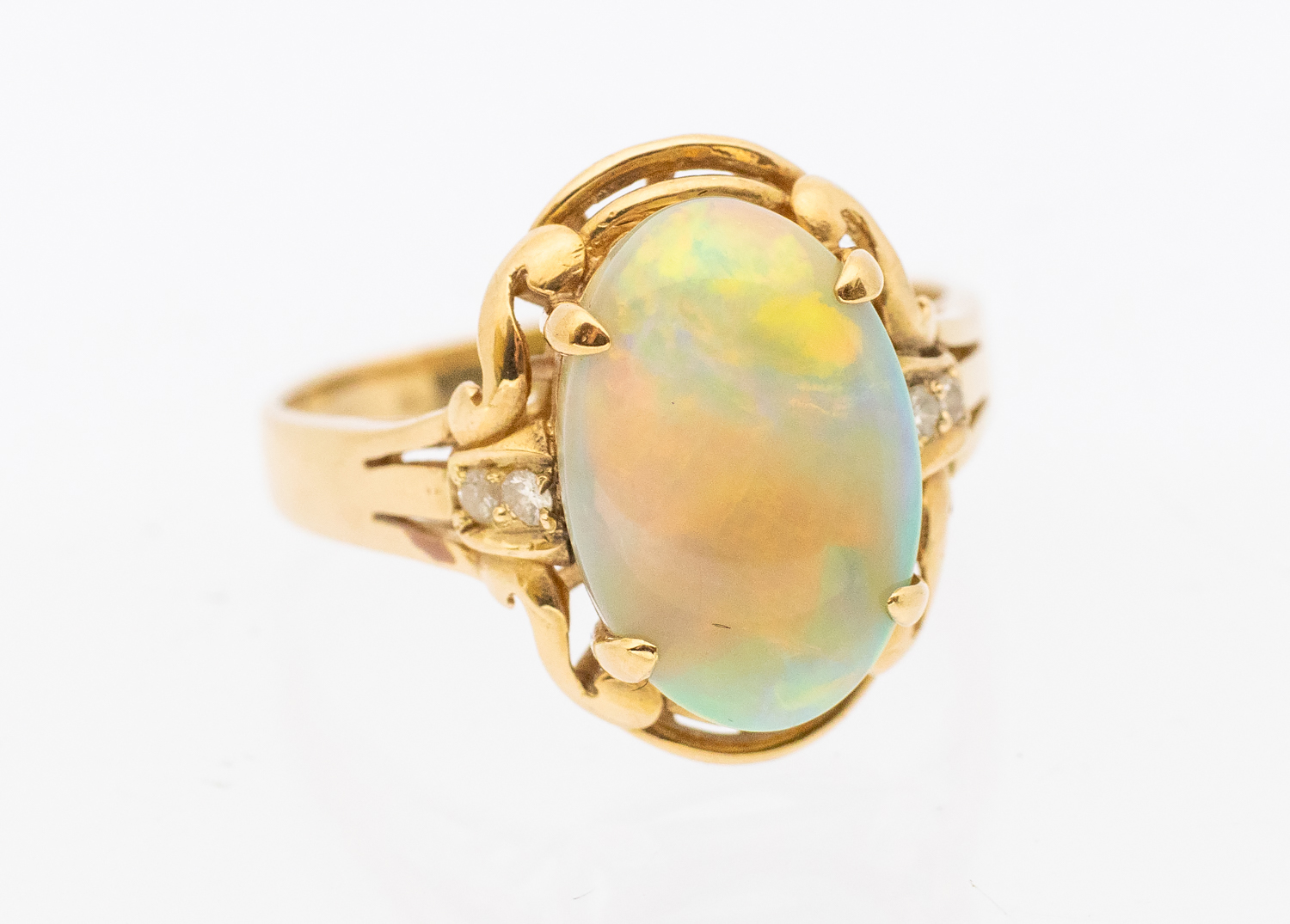 An opal and diamond 14ct gold ring, comprising an oval opal approx 9x9mm, with orange, green and