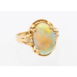 An opal and diamond 14ct gold ring, comprising an oval opal approx 9x9mm, with orange, green and