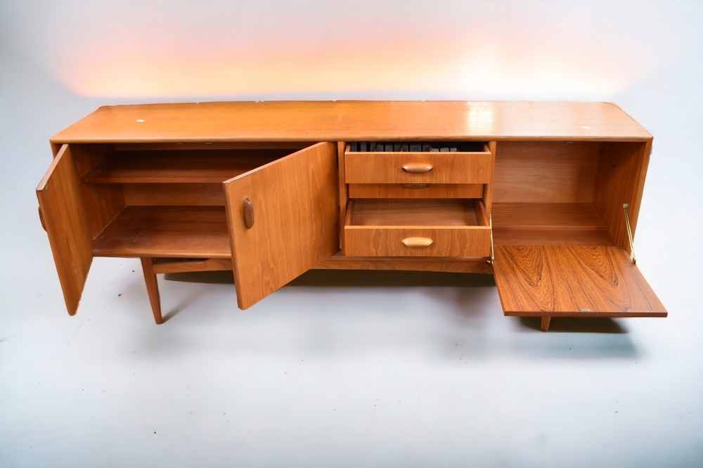 A mid 1970s teak G plan sideboard with three opening cupboard doors and four drawers, 206cm L x 46cm - Image 3 of 4