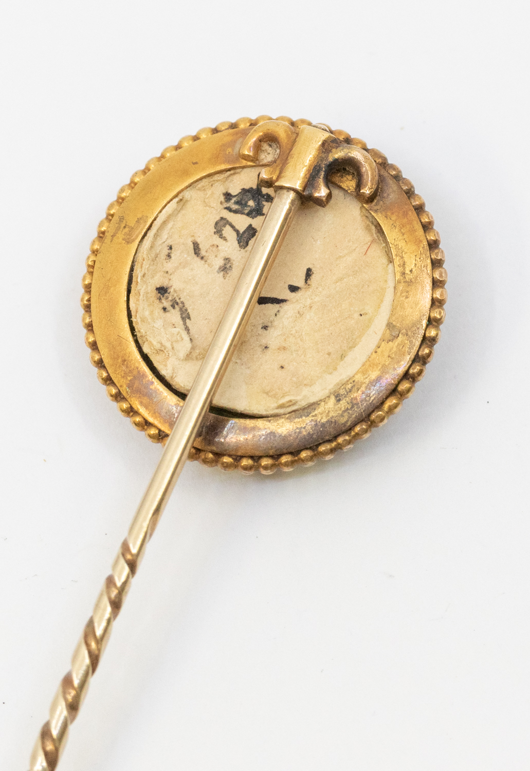 An Essex crystal gold stick pin, comprising a round crystal depicting a Greyhound, within a beaded - Image 2 of 2
