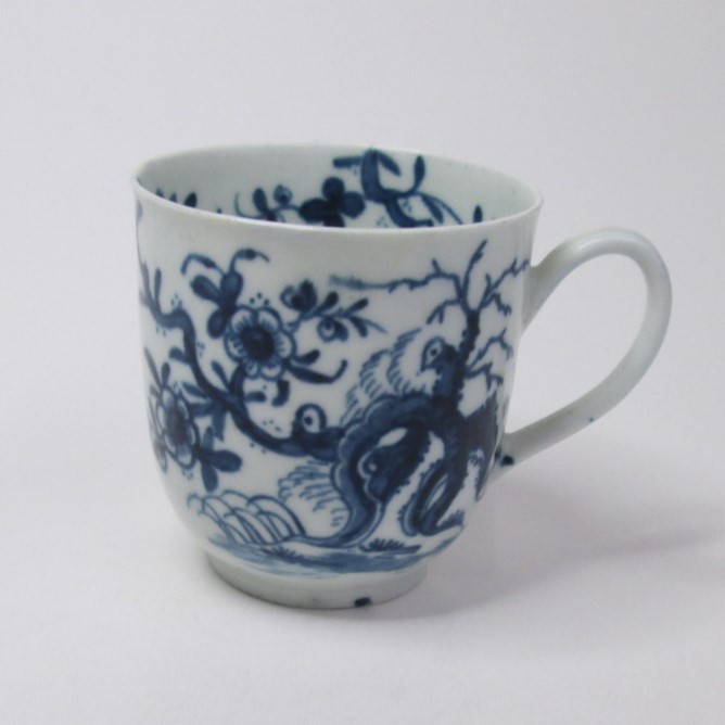 A Worcester blue and white coffee cup painted with the prunus root pattern. Circa; 1760-70