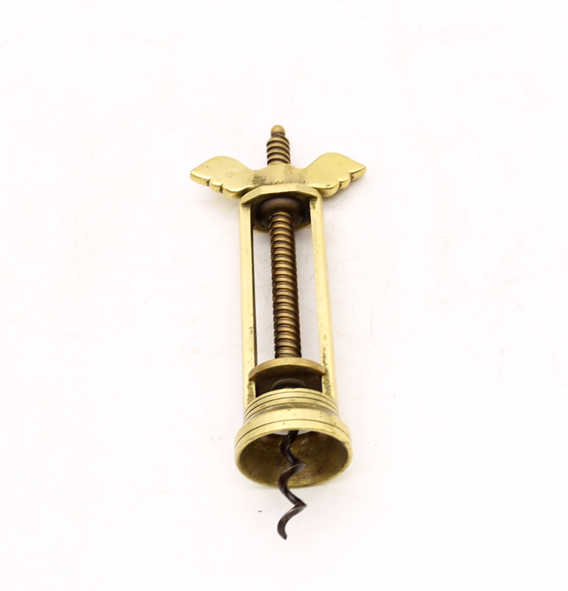 Unusual brass early 20th Century corkscrew with ring pull.