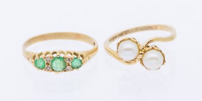 An emerald and diamond set 9ct gold ring set with three graduated round mixed cut emeralds, with