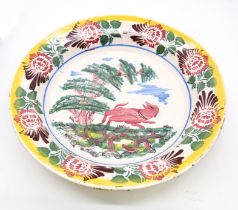 A 20th Century large glazed Majolica charger with foliage and decorative scene to bowl, 38cm