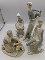 A collection of four Lladro figures