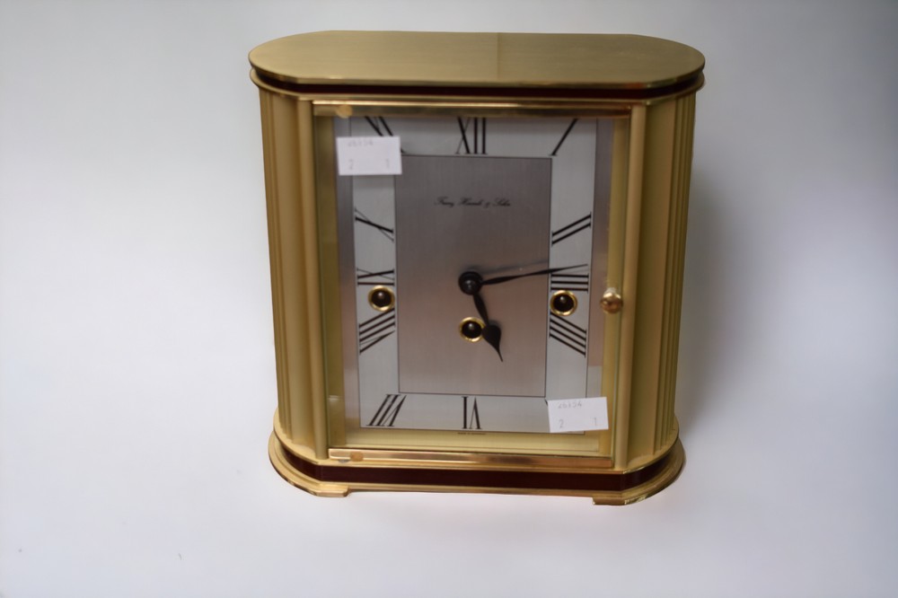 A Franz Hermle & John bright gilt style metal cased mantel clock, roman numerals, untested.