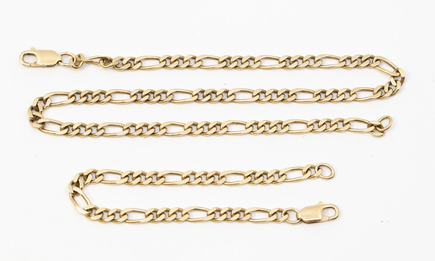 A 9ct gold Figaro chain and matching bracelet, width approx 5mm, necklace length approx 44cm,