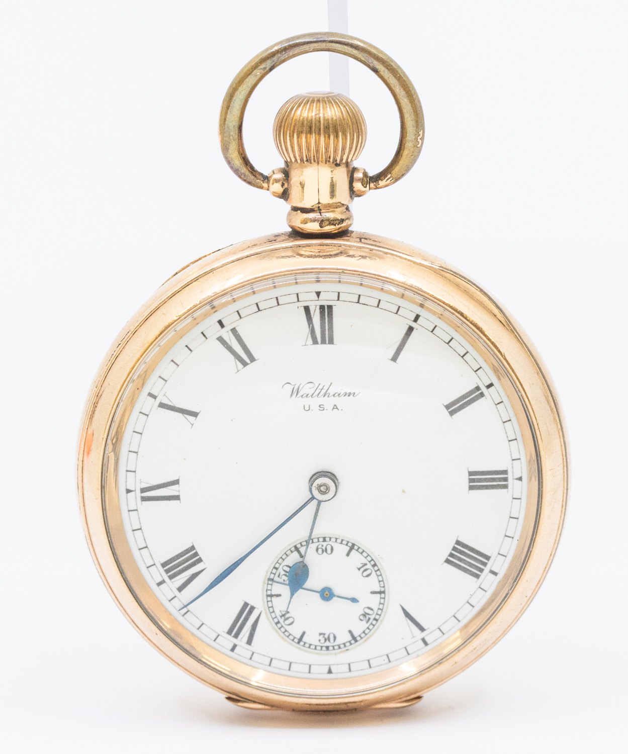 A Waltham USA gold plated open faced pocket watch, comprising a white enamel signed dial with