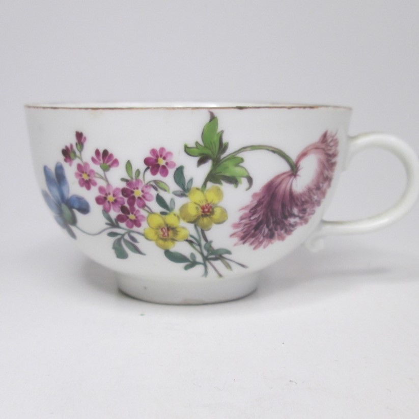 A Meissen cup and saucer painted with flower sprays and specimens with a brown rim line. Circa; 19th - Image 3 of 4