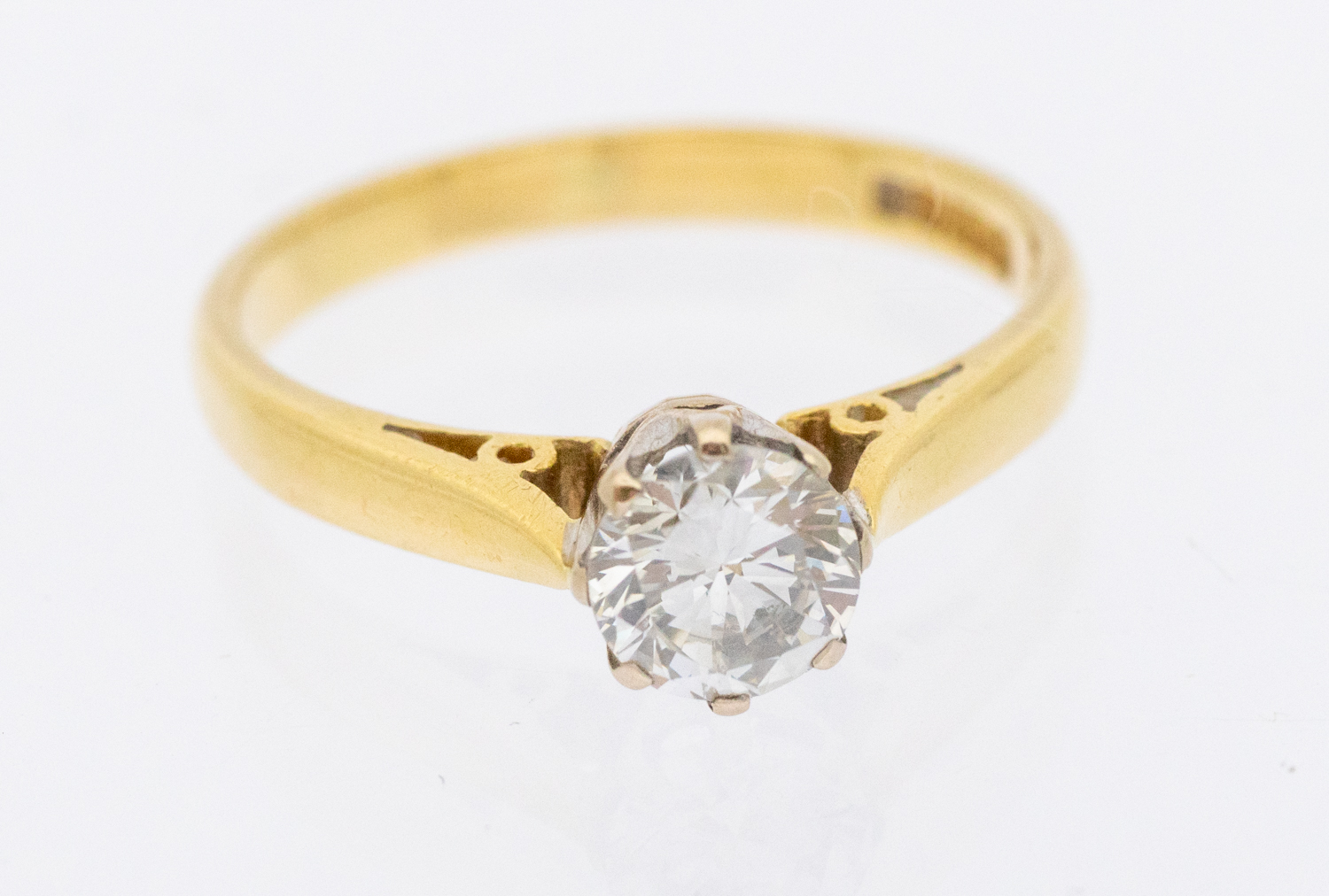 A diamond and 18ct gold solitaire ring, comprising a round brilliant cut diamond weighing approx