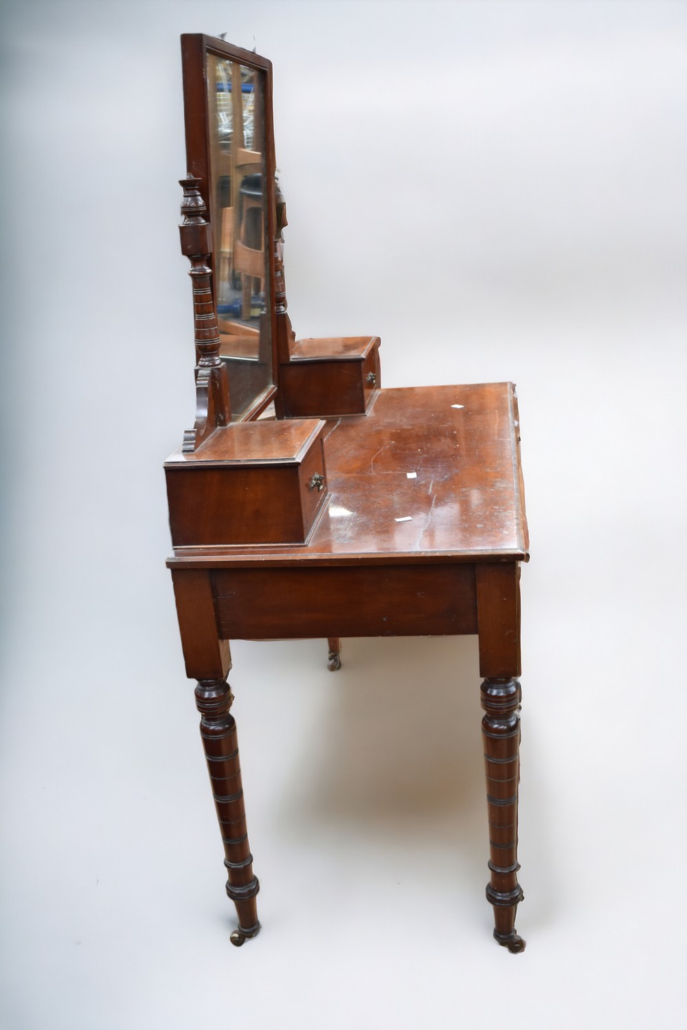 A Victorian mahogany bedroom dressing table with two top side drawers, two drawers to frieze,