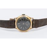 A 9ct gold 1940's Junior wristwatch, comprising a black dial with Arabic markers, subsidiary dial at