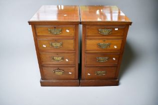 A pair of mahogany small chests, each of four drawers, that have had a back rail at some point,