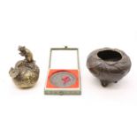 Oriental bronze items comprising a figural rat on a peach, tripod incense bowl decorated with