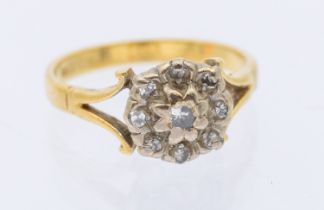 A diamond and 18ct gold cluster ring, comprising a round cluster set with small diamonds, scrolled