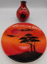A Poole African sky wall plate along with a Poole posie vase.