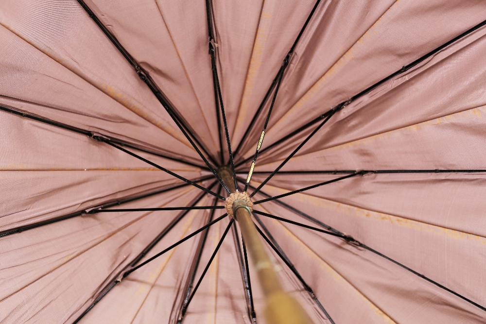 A 20th century wooden handled parasol, with faux amber plastic rounded end and London silver mount - Image 5 of 7