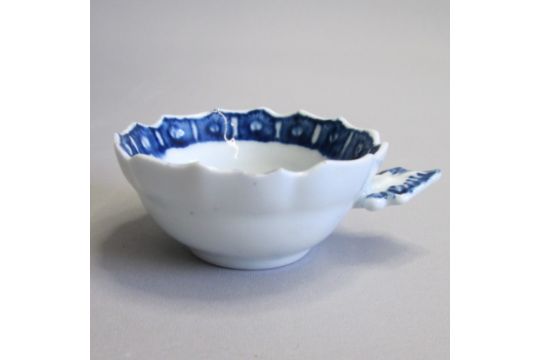 A small, rare Derby blue and white wine taster/tastevin with ogee shaped bowl and lobed rim, painted