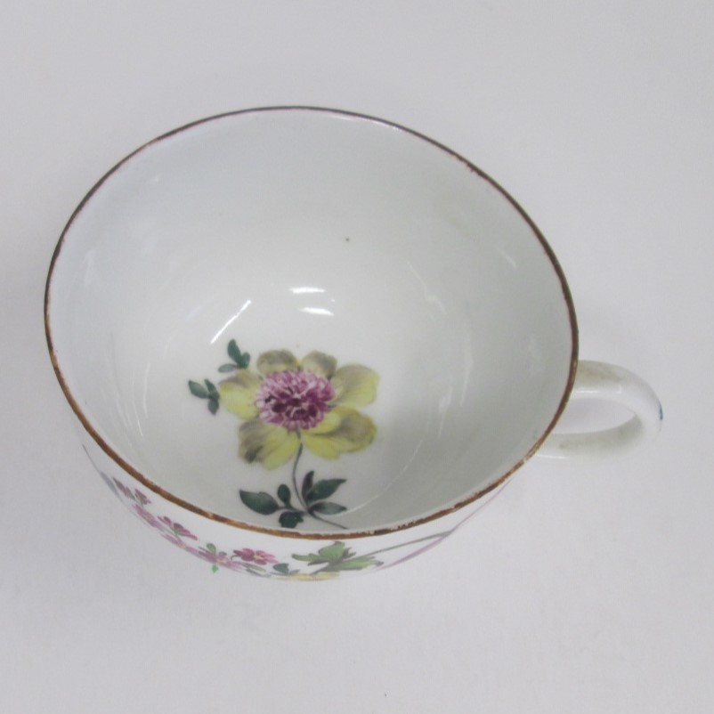 A Meissen cup and saucer painted with flower sprays and specimens with a brown rim line. Circa; 19th - Image 4 of 4