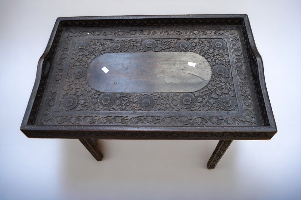 An early 20th Century Indian carved fold down Butlers tray. - Image 2 of 3