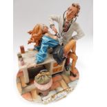 A large Capodimonte erotic doctor and patient scene signed to base with blue crown mark , thumb