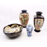 A collection of early 20th century Japanese Satsuma that includes two vases with matching bowl