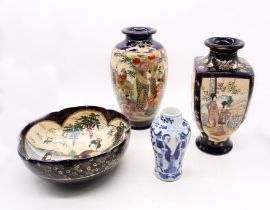 A collection of early 20th century Japanese Satsuma that includes two vases with matching bowl